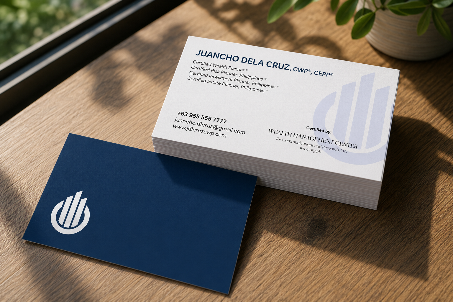 Printed WMCAA-style business cards arranged on a desk.